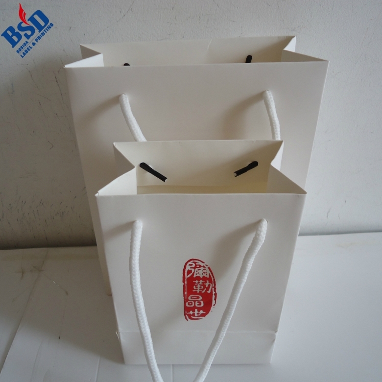 White cardboard hand bag 